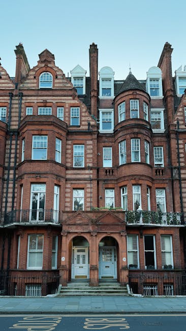 The image depicts the facade of a historic red-brick building typical of Belgravia terraces in Eaton Square, Westminster, with ornate architectural details, multiple bay windows, and decorative elemen