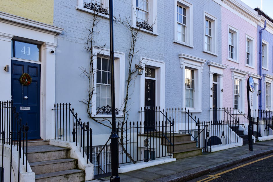 The image depicts the facade of a historic red-brick building typical of Belgravia terraces in Eaton Square, Westminster, with ornate architectural details, multiple bay windows, and decorative elemen